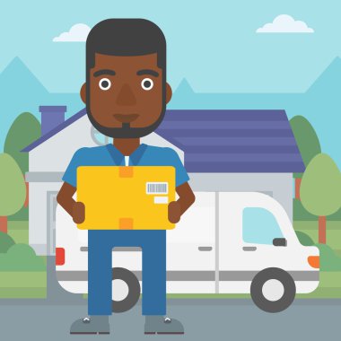 Karton kutular taşıyan teslimatçı.