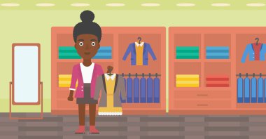 Woman holding dress with jacket.