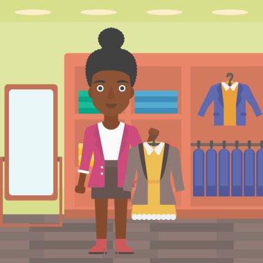 Woman holding dress with jacket.