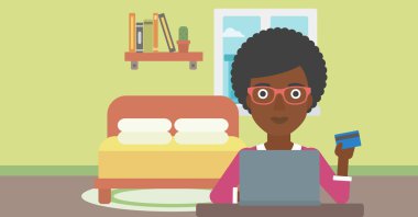 Woman shopping online using her laptop.