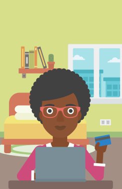 Woman shopping online using her laptop.