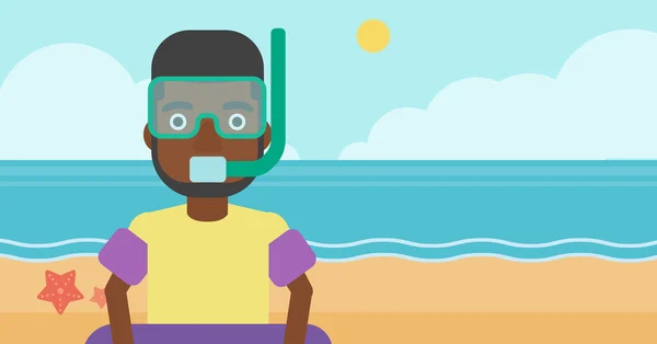 Muž s vybavení na šnorchlování na pláži. — Stockový vektor
