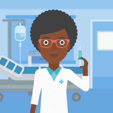 Doktor hastane koğuşunda şırınga.