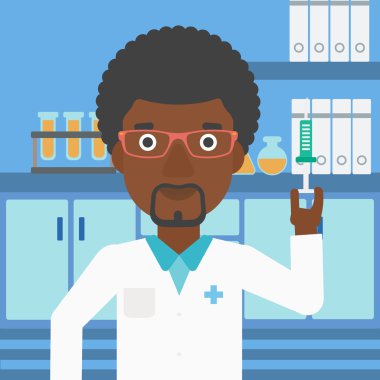 Laboratuvarda şırınga ile laboratuvar asistanı.