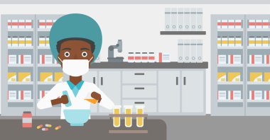 Eczacı ilaç hazırlıyor.