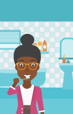 Dişlerini fırçalayan kadın.