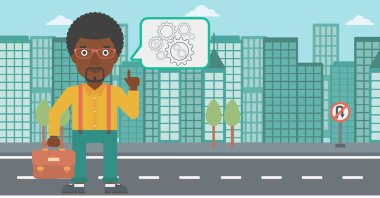 Businessman pointing at cogwheels.