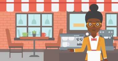 Barista ayakta yakınındaki kahve makinesi.