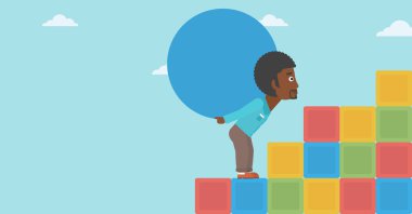 Adam taşıma beton topu yokuş yukarı.