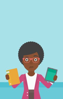 Woman choosing between book and tablet computer.