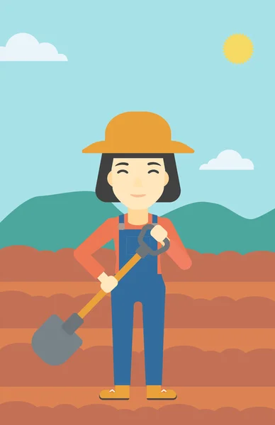 Female farmer with shovel vector illustration. — Stock Vector