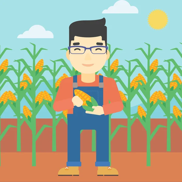 Фермер тримає кукурудзу Векторні ілюстрації . — стоковий вектор
