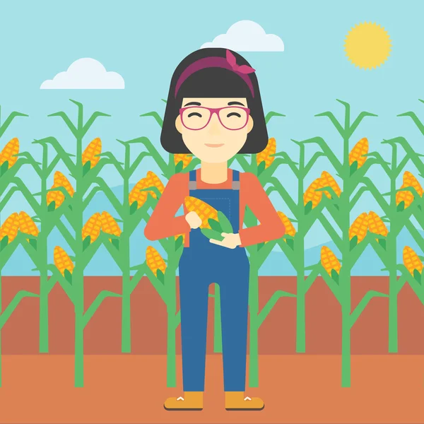 Agricultora sosteniendo ilustración vector de maíz . — Vector de stock