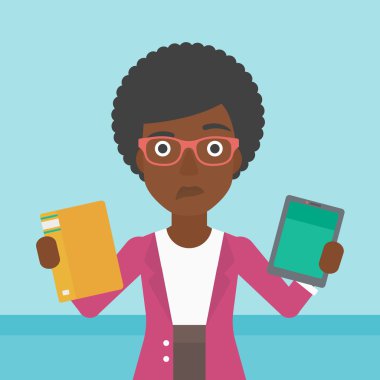 Woman choosing between book and tablet computer.