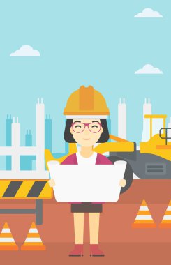 Bir plan tutan mühendisi.