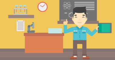 Erkek öğrenci sınıfta tablet bilgisayar kullanarak.