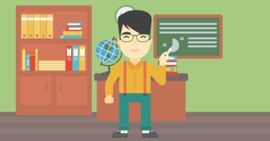 Öğretmen elinde tebeşir ile yazı tahtası önünde.