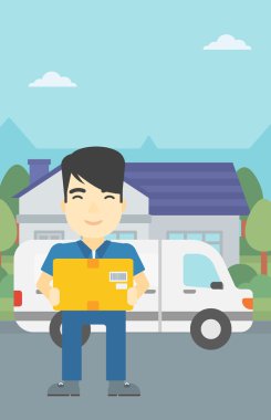 Karton kutular taşıyan teslimatçı.