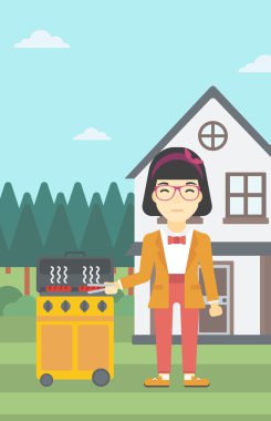 Kadın aşçılık etindeki gaz Barbekü Izgara.