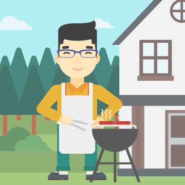 Man barbekü ızgara et pişirme.