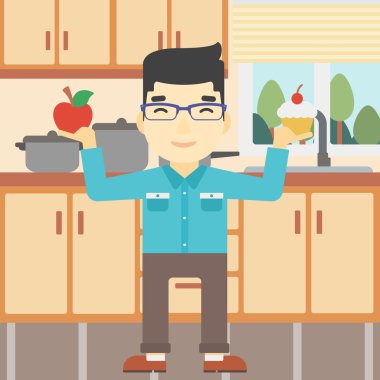 Adam elma ve cupcake arasında seçim yapma.