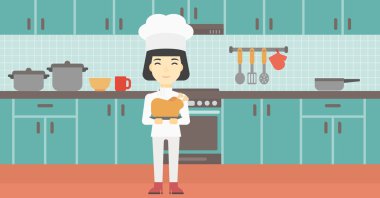 Şef tencere tutarak kavrulmuş tavuk.