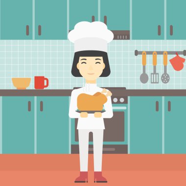 Şef tencere tutarak kavrulmuş tavuk.