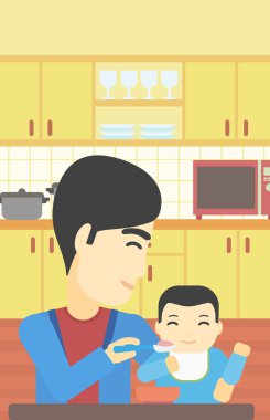 Baba bebeği besliyor.