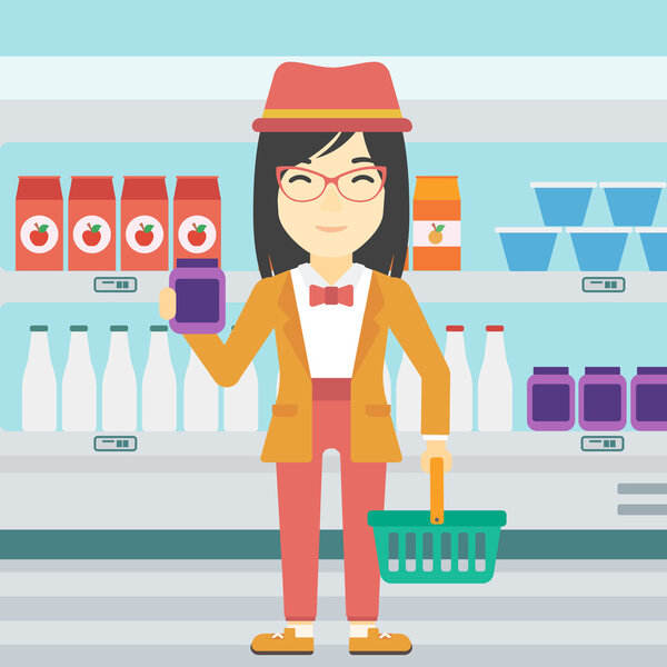 Customer with shopping basket and tube of cream.