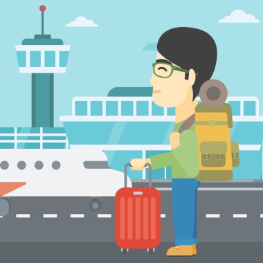 adam havaalanında bavul ile.