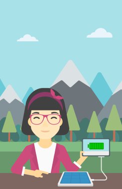 Solar panel charging tablet computer.