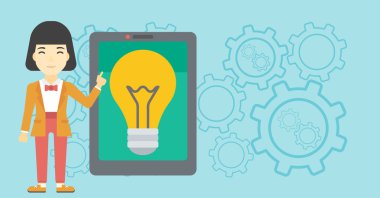 Büyük tablet bilgisayarda işaret eden kadın.