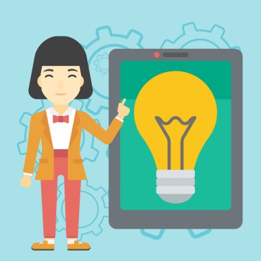 Büyük tablet bilgisayarda işaret eden kadın.