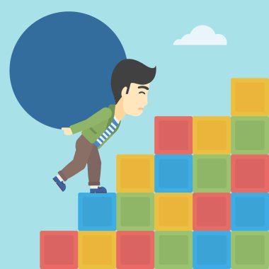 Adam taşıma beton topu yokuş yukarı.