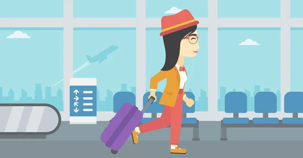 Mujer caminando con maleta en el aeropuerto . — Vector de stock