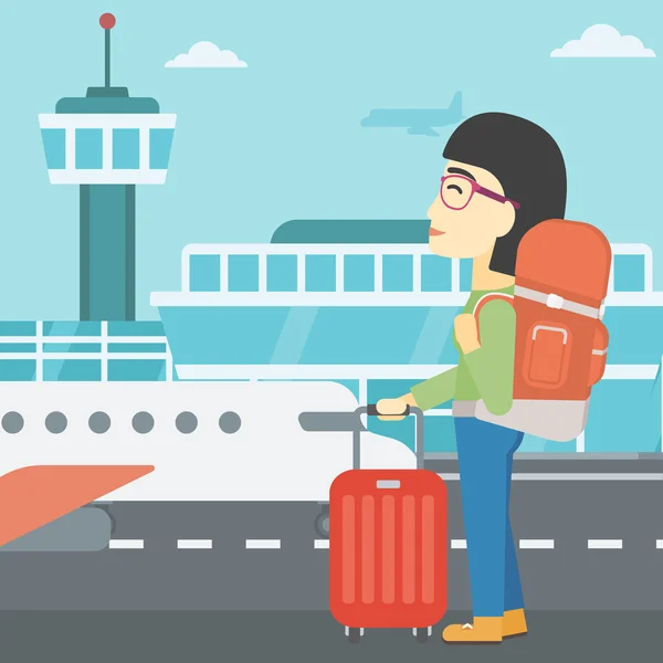 Woman at the airport with suitcase. — Stock Vector