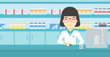 Pharmacist at counter with computer monitor.