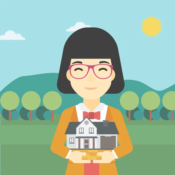 Woman holding house model vector illustration. — 图库矢量图片