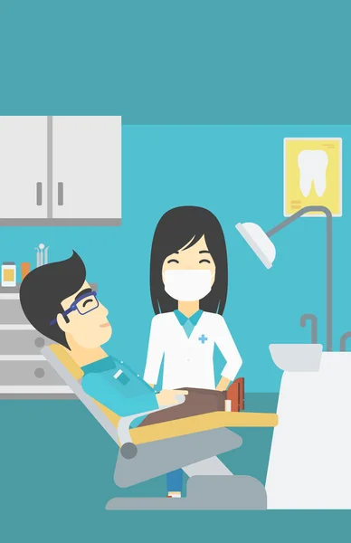 Paciente e médico no consultório odontológico . —  Vetores de Stock