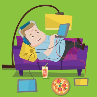 Man lying on sofa with many gadgets. clipart