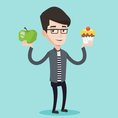 Adam elma ve cupcake arasında seçim yapma.