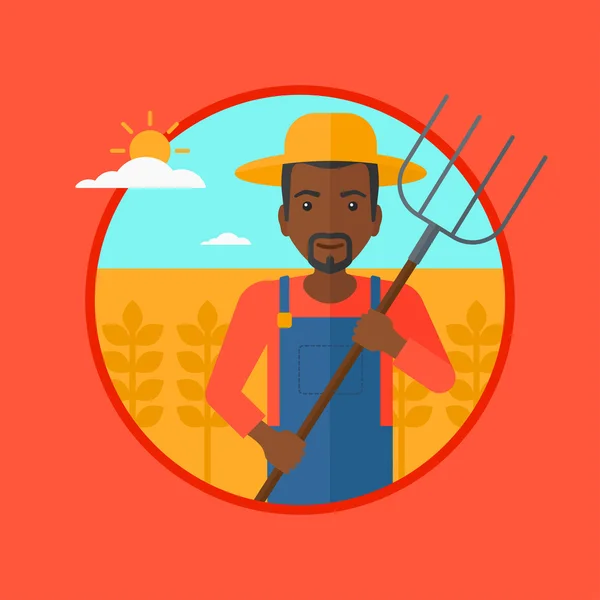 Agricultor com forquilha no campo de trigo . — Vetor de Stock