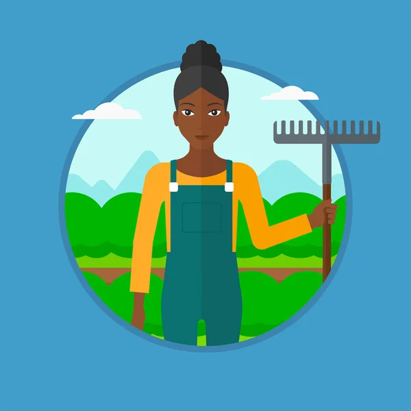 Agricultor con rastrillo en el campo de repollo . — Vector de stock