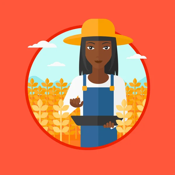 Agricoltore con tablet sul campo . — Vettoriale Stock