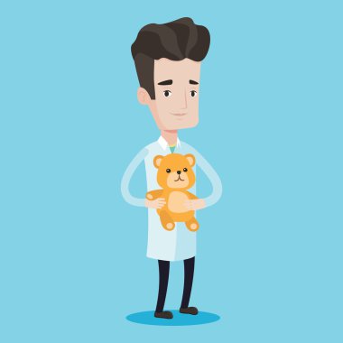 Çocuk doktoru doktor holding oyuncak ayı.