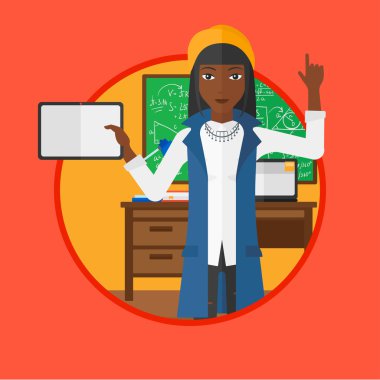 Kız öğrenci sınıfta tablet bilgisayar kullanarak.