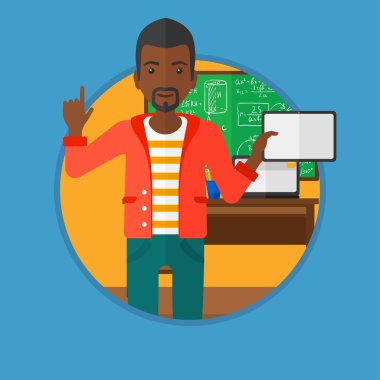 Erkek öğrenci sınıfta tablet bilgisayar kullanarak.