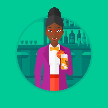 Woman drinking orange cocktail at the bar.