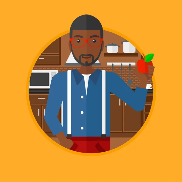 Junger Mann mit Apfel in der Küche. — Stockvektor