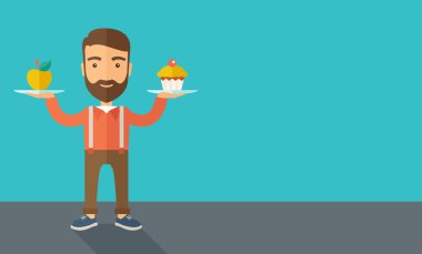 adam onun iki eli cupcake ve elma ile taşır.